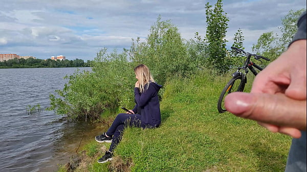 Jerk off a dick near a stranger girl in public